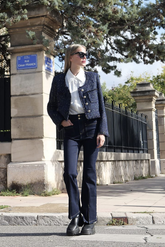 a lady in a white shirt, a sequin tweed jacket and a pair of skinny jeans